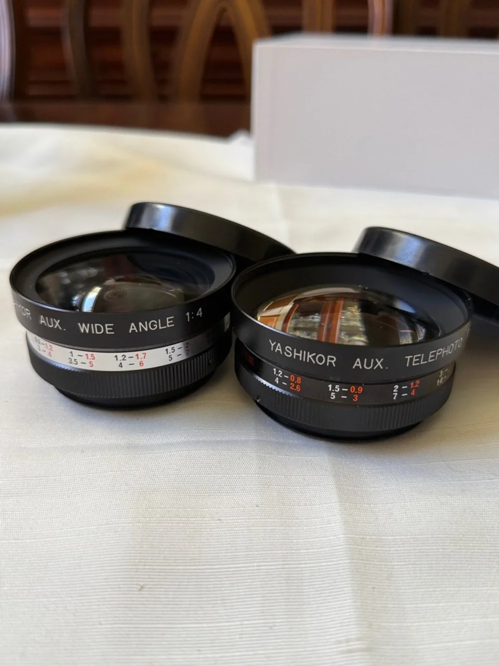 Set of 2 VTG Yashica Yashikor aux Telephoto & Wide Angle 1:4 Lens with cups